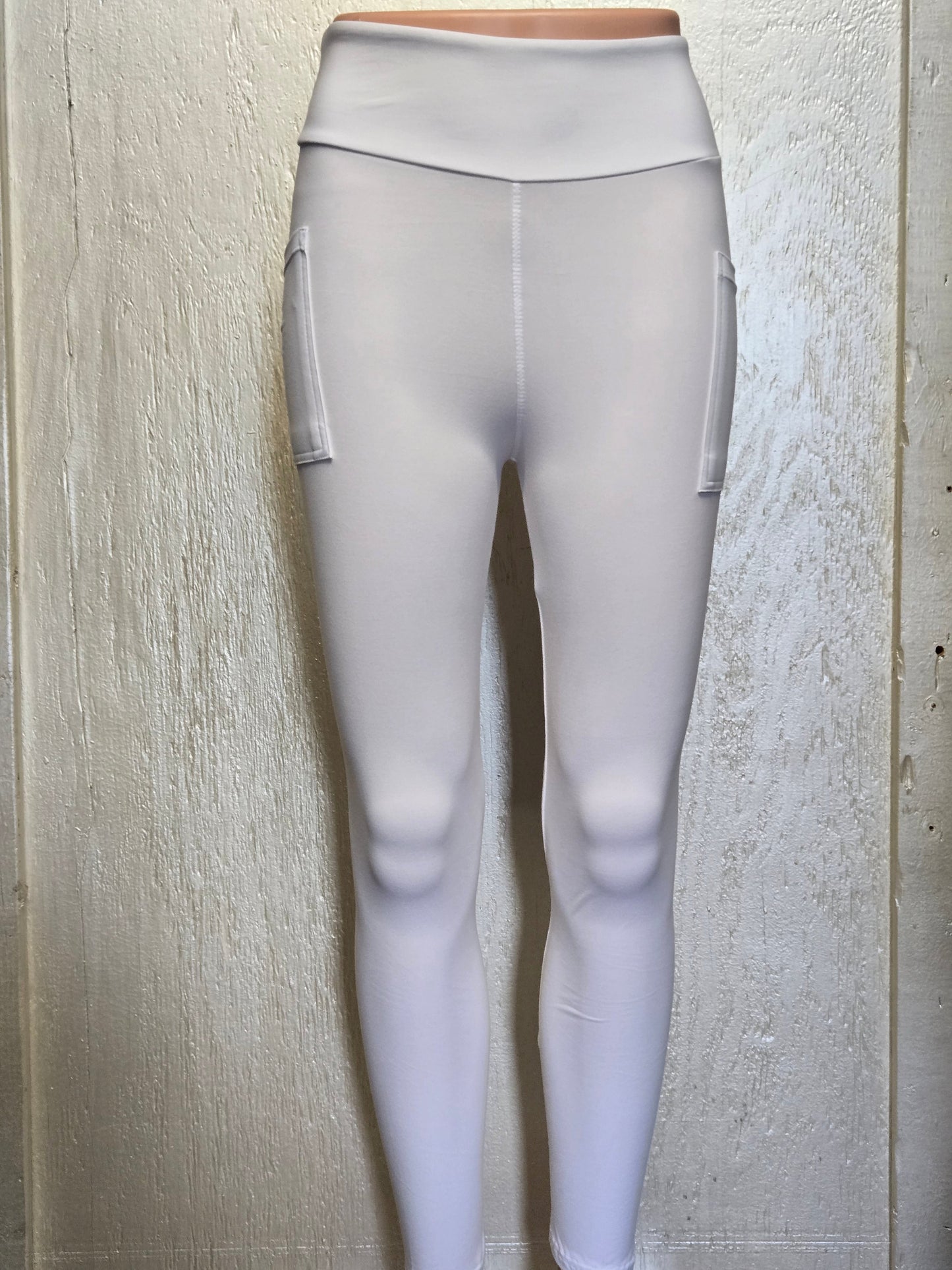 White leggings, capris, and biker shorts with pockets