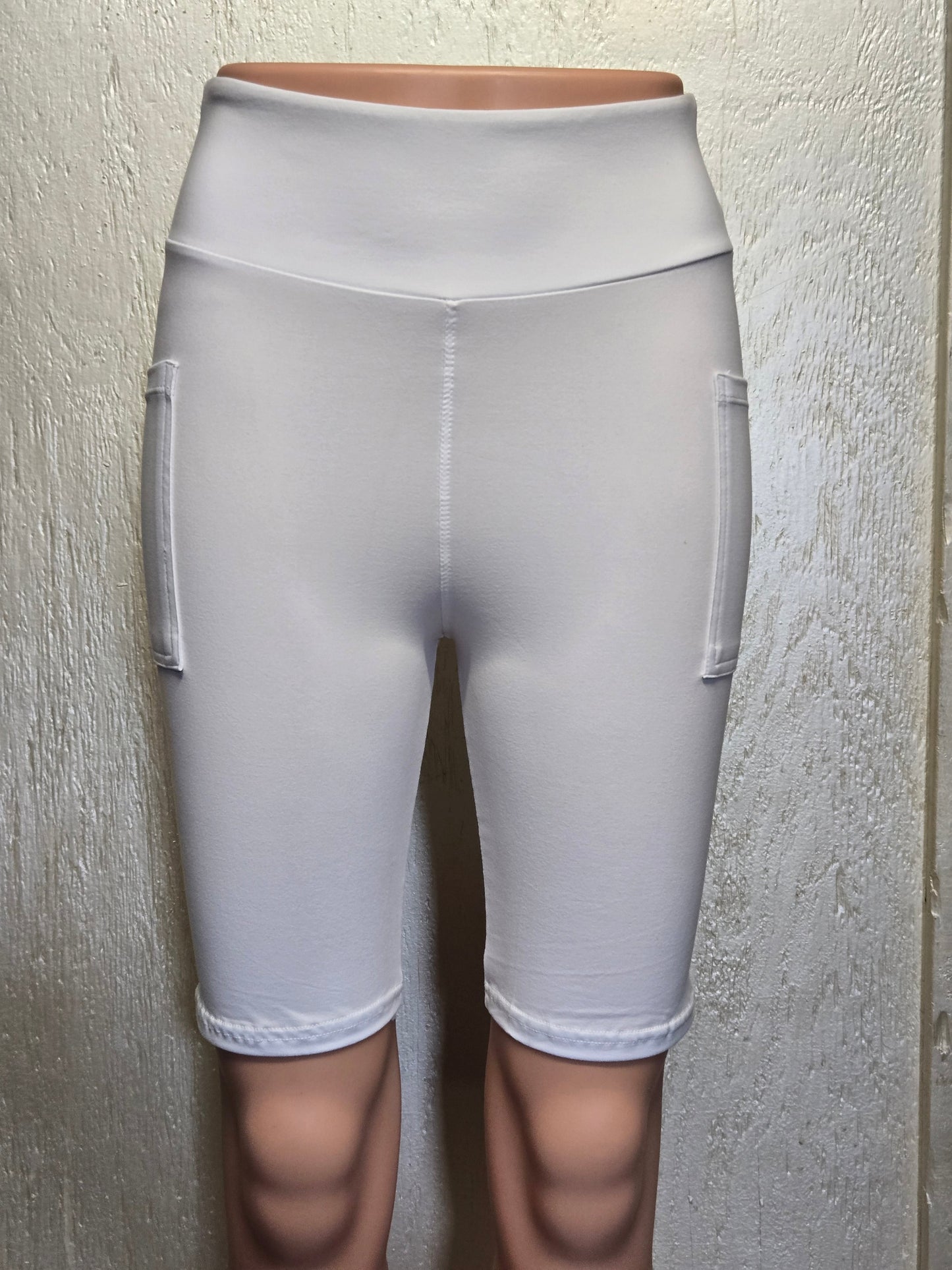 White leggings, capris, and biker shorts with pockets