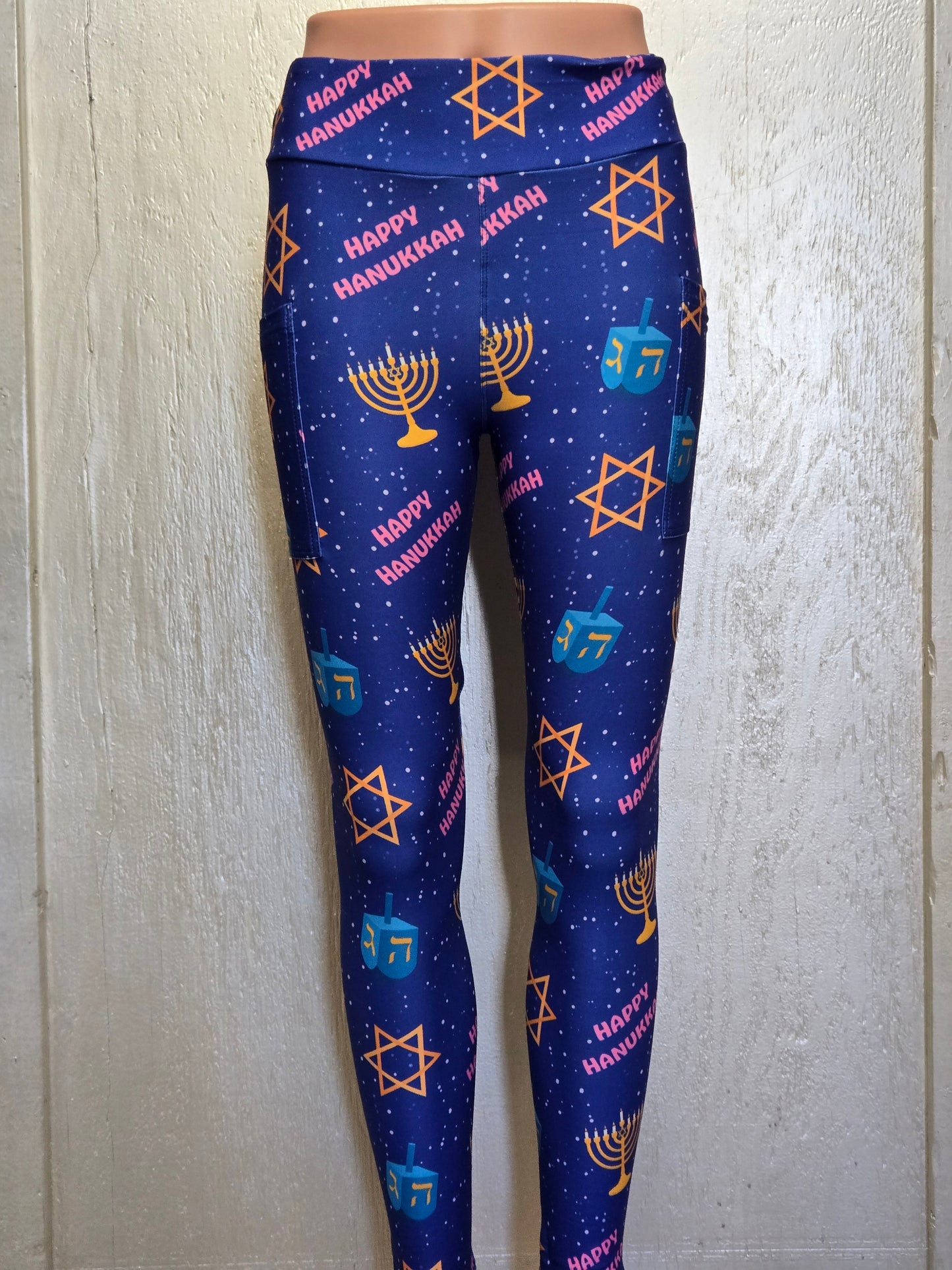Happy Hanukkah on blue leggings with pockets