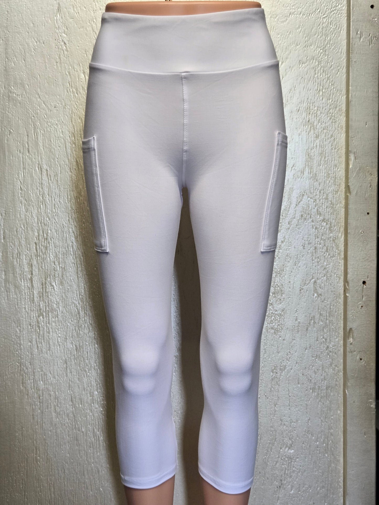 White leggings, capris, and biker shorts with pockets